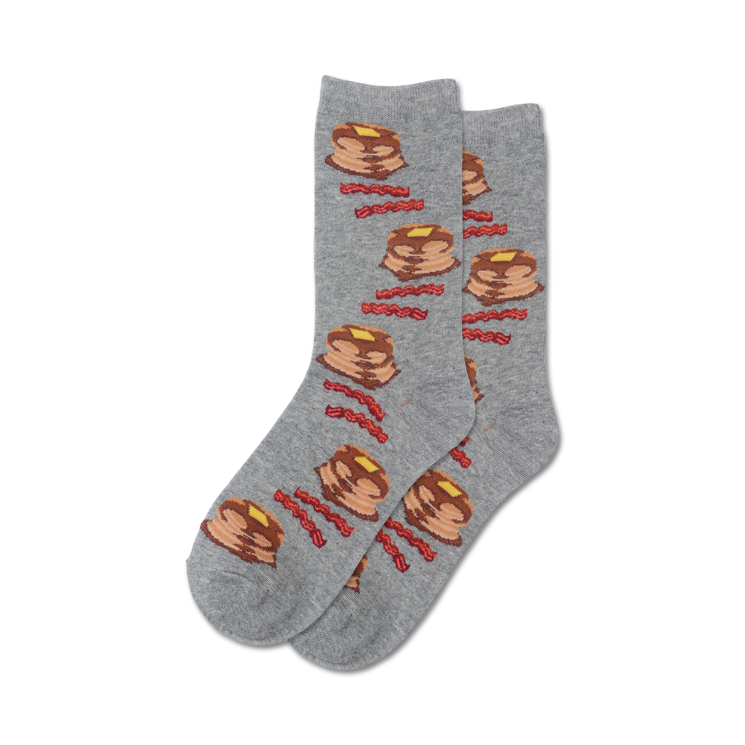 Lifestyle shot of a person's feet wearing grey Pancakes and Bacon socks.
