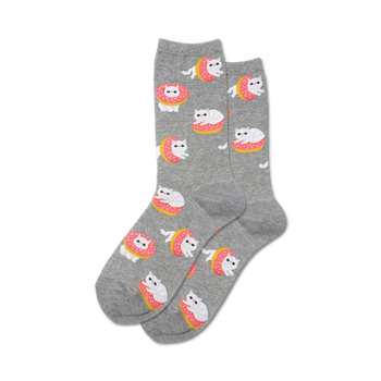 womens cat donut crew socks. white cat laying in pink icing donut on gray background.   