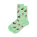Lifestyle shot: A model's feet wearing the light green Party Beagle socks.