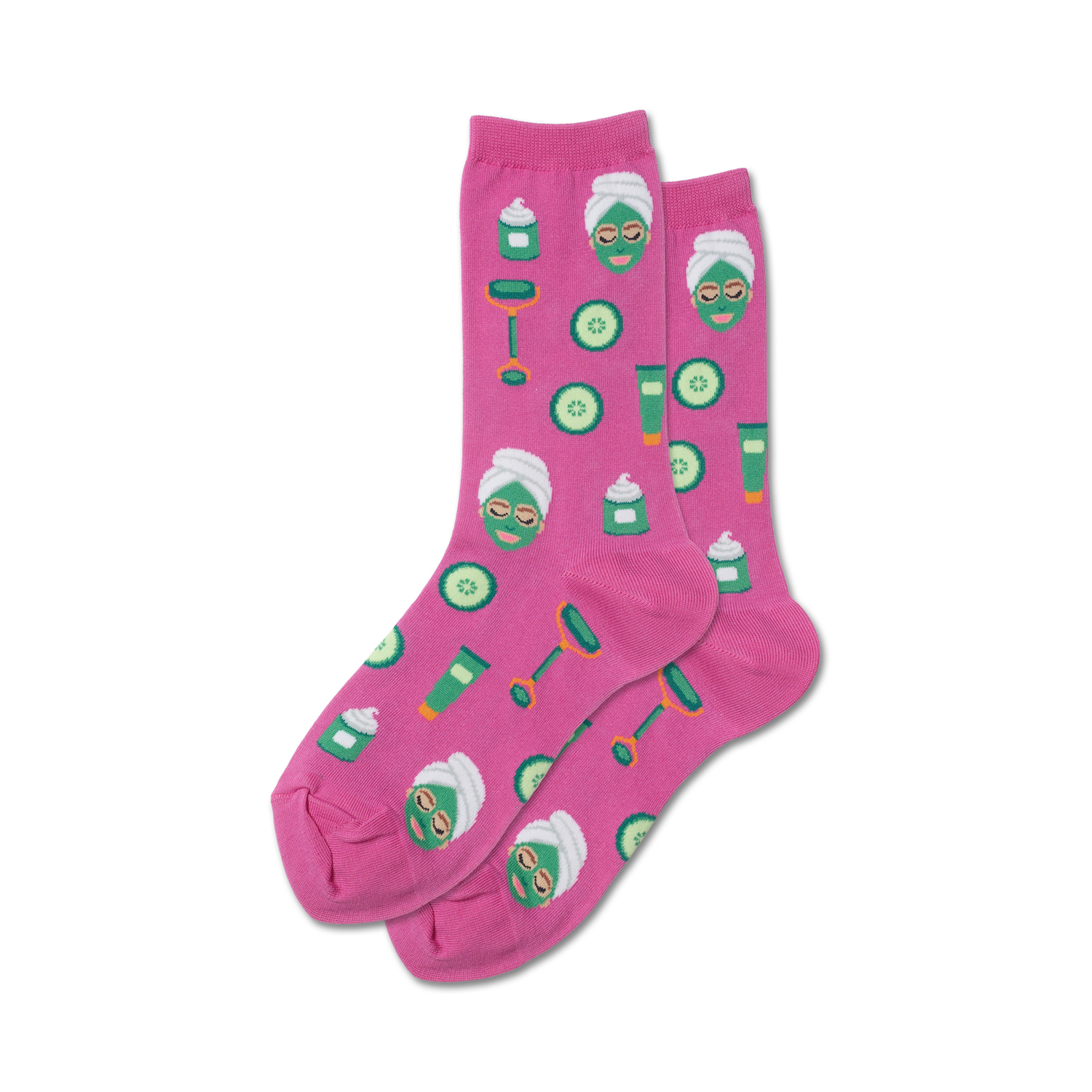 Pair of pink crew socks with a fun spa-themed design:  facial masks, cucumbers, and beauty products.