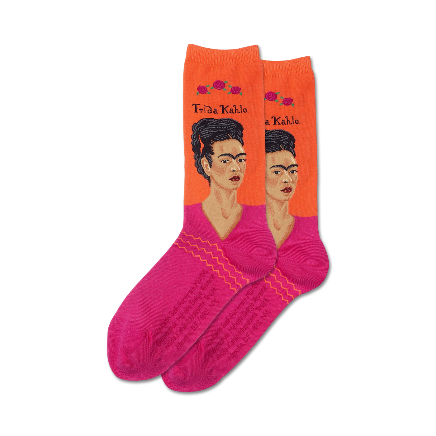 Pair of women's crew socks.  Orange background with pink accents and a repeated image of Frida Kahlo's self-portrait.