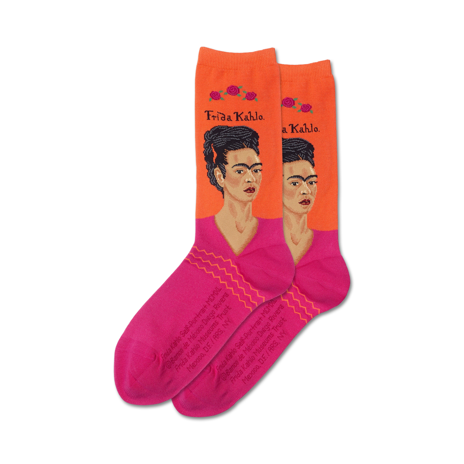 Pair of women's crew socks.  Orange background with pink accents and a repeated image of Frida Kahlo's self-portrait.