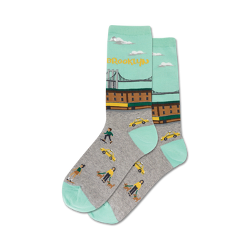 mint green women's crew socks featuring brooklyn-themed icons like taxis, dog walkers, and skateboarders.  