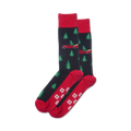 Pair of crew socks in navy and red, featuring a pattern of red trucks carrying Christmas trees and snowflakes on the bottom.