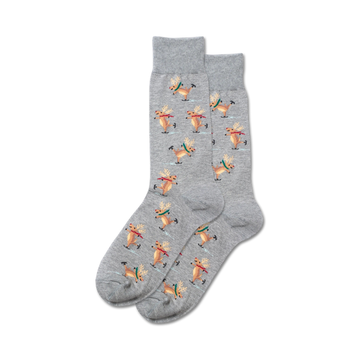 mens crew socks with a gray background featuring a pattern of brown reindeer ice skating on a light blue background.   }}