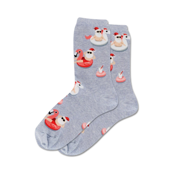 women's crew socks with a playful festive pattern featuring santa clauses lounging on pink flamingos