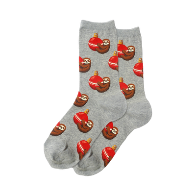 Pair of crew socks, heather gray, featuring a repeating pattern of pixelated sloths hugging red Christmas ornaments.