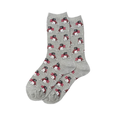 Pair of grey crew socks with a repeating pattern of brown and white dogs wearing red holiday scarves.