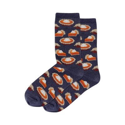 A pair of navy blue crew socks with a repeating pattern of orange pumpkin pie slices and whipped cream.