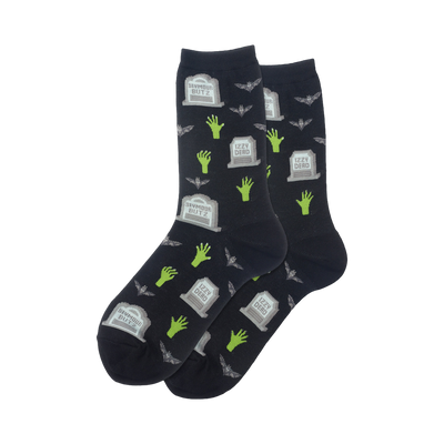 Pair of dark crew socks featuring a pattern of gray gravestones, lime green zombie hands, and small bats.
