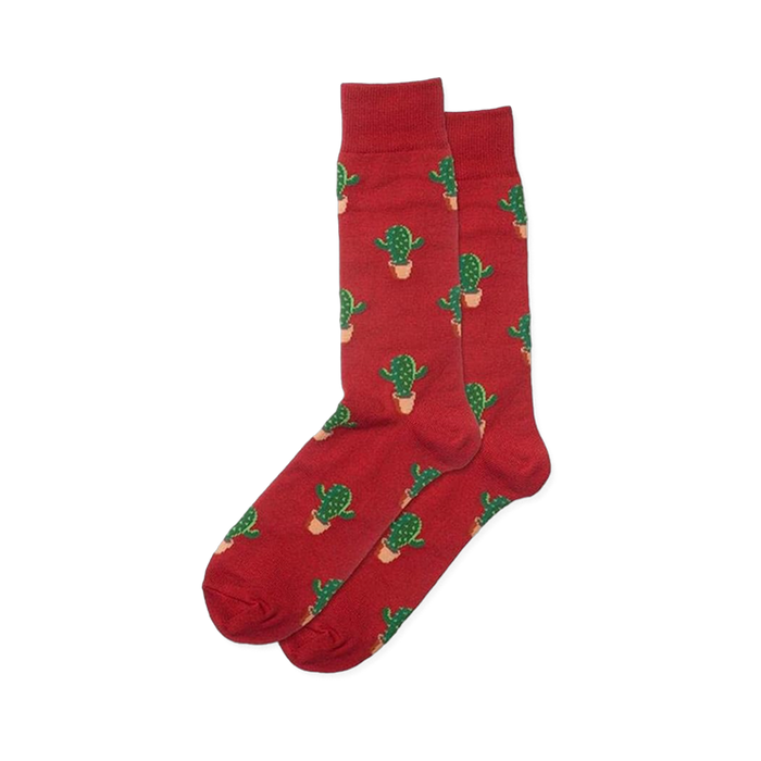 Pair of red crew socks with an all-over repeating pattern of green cactus plants in light tan pots. }}