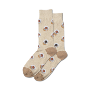 Pair of beige crew socks with a repeating pattern of brown coffee cups.  The socks have a taupe heel and toe.