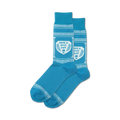 Pair of blue crew socks with a white Greek key border and central design that says, 'Have A Nice Day' inside a shield with coffee cup graphic.