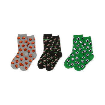 Three pairs of crew socks. Left: grey with orange basketballs. Middle: black with brown footballs, green lines. Right: green with soccer balls.