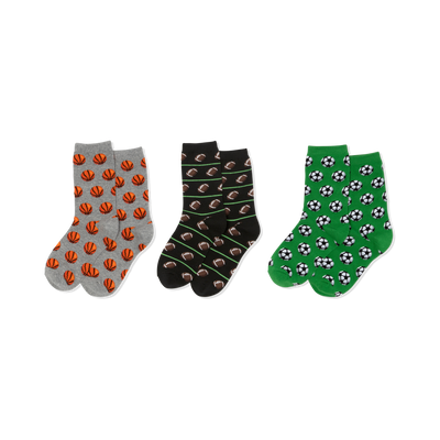 Three pairs of crew socks. Left: grey with orange basketballs. Middle: black with brown footballs, green lines. Right: green with soccer balls.