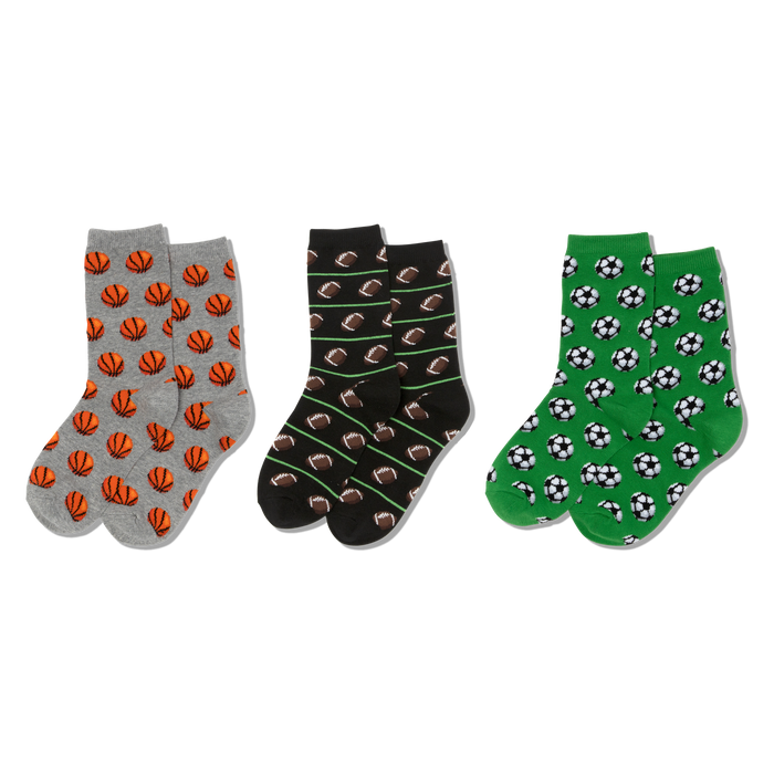 Three pairs of crew socks. Left: grey with orange basketballs. Middle: black with brown footballs, green lines. Right: green with soccer balls. }}