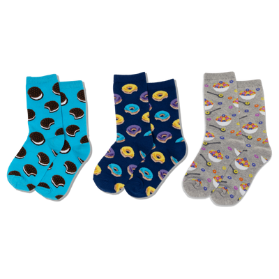 Three pairs of crew socks: light blue with sandwich cookies, navy with yellow and purple donuts, and grey with cereal bowls.