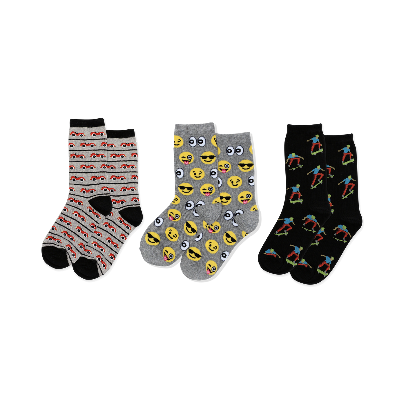 Three pairs of crew socks: light gray with red cars, gray with yellow emojis, black with colorful skateboarders, all with black accents.