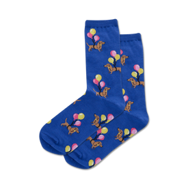 blue crew socks with a pattern of brown dachshunds wearing yellow party hats, pink, blue and yellow balloons.   