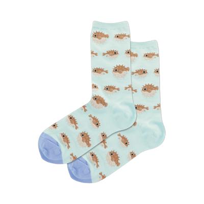 Pair of women's crew socks. Light teal background with a repeating pattern of light brown pufferfish.  Light periwinkle blue cuffs.