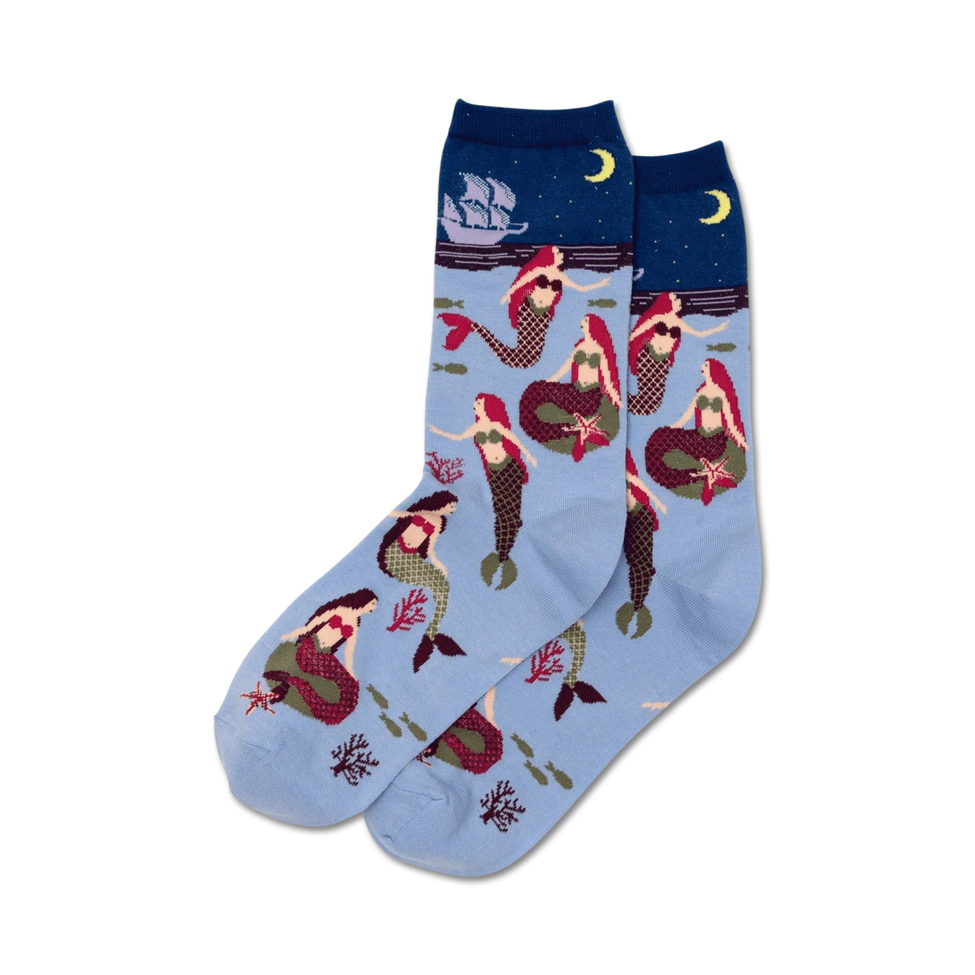 Pair of women's crew socks in light blue featuring red-haired mermaids, coral, starfish, and a sailing ship at night.