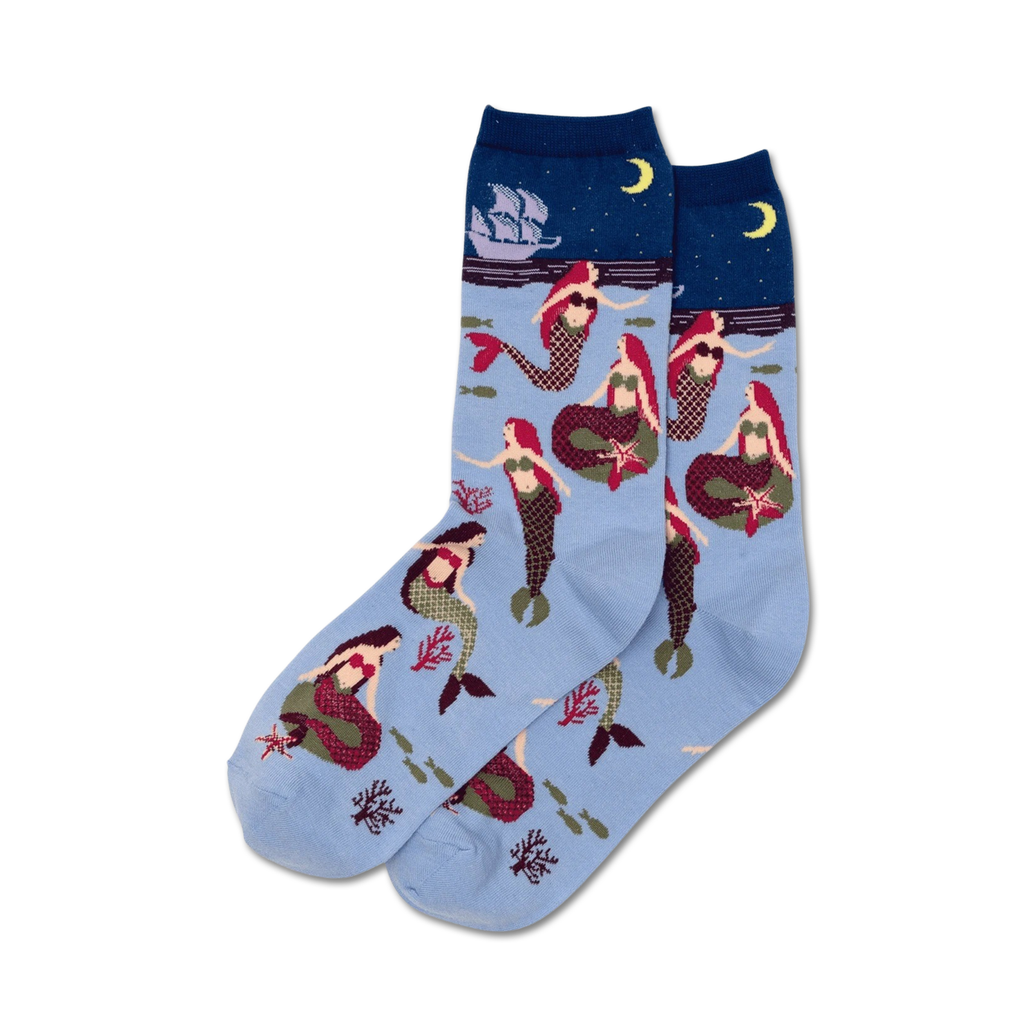 Pair of women's crew socks in light blue featuring red-haired mermaids, coral, starfish, and a sailing ship at night.