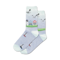 Pair of crew socks in light blue featuring a beach scene: lighthouse, houses, sailboats, and seagulls.