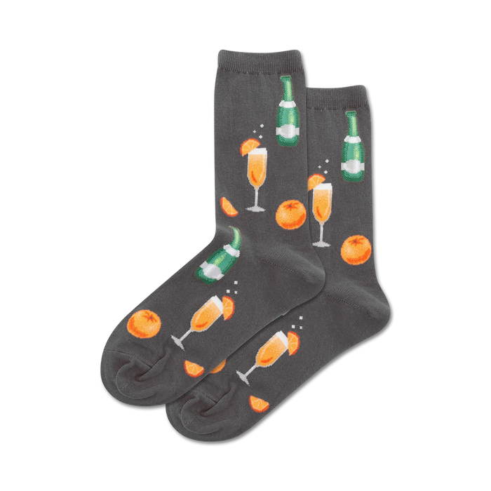 women's gray crew socks feature an allover pattern of green champagne bottles, orange slices, and mimosa cocktails.  