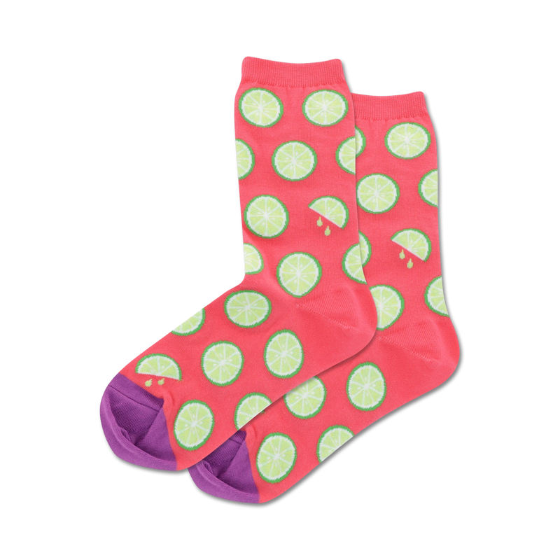 Pair of crew socks; coral pink with lime slices and purple heel and toe; orange socks in light blue with orange slices and mint green heel and toe.