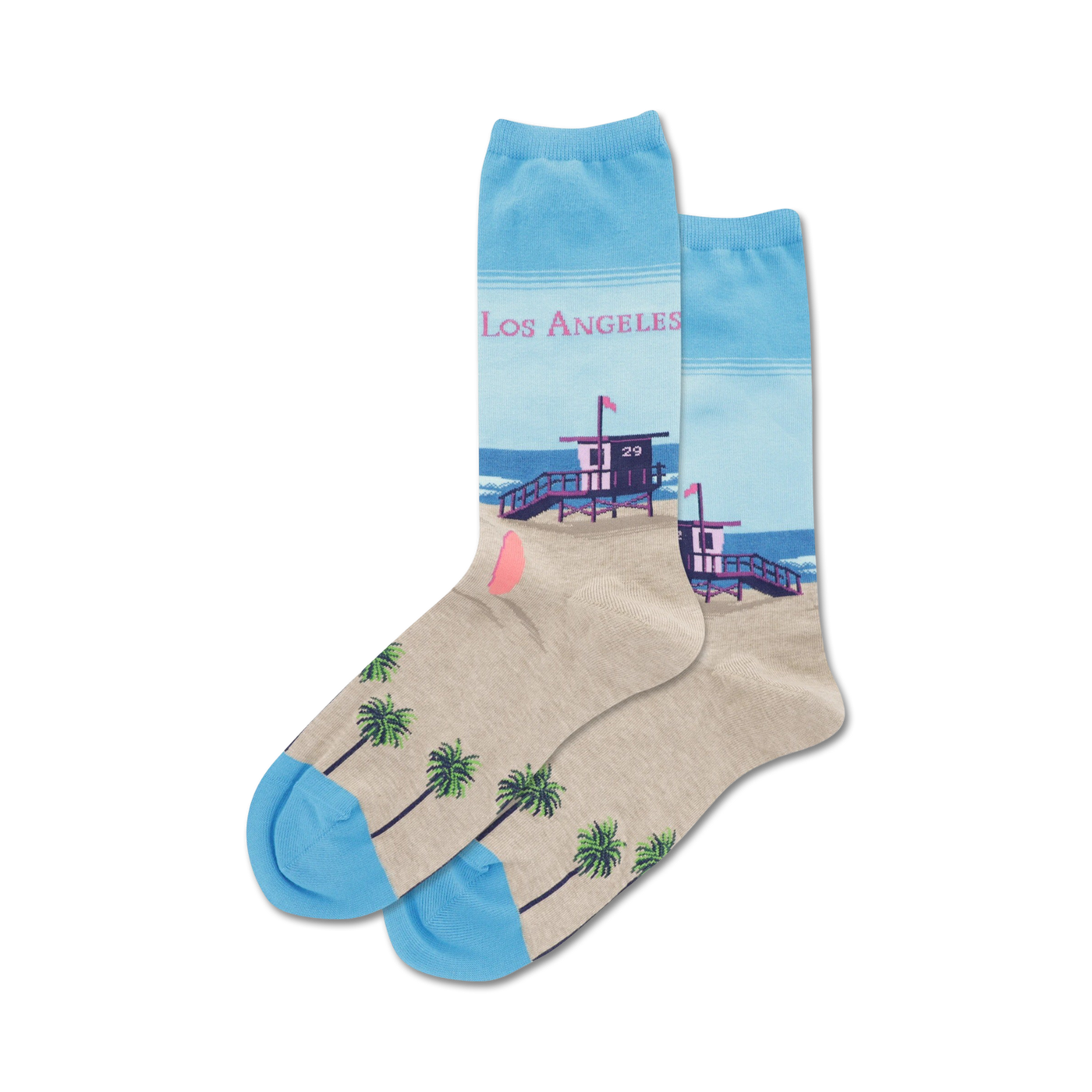 Pair of crew socks showcasing a Los Angeles beach scene. Light beige with palm trees at the bottom, light blue at the top with a lifeguard tower and 'Los Angeles' text.