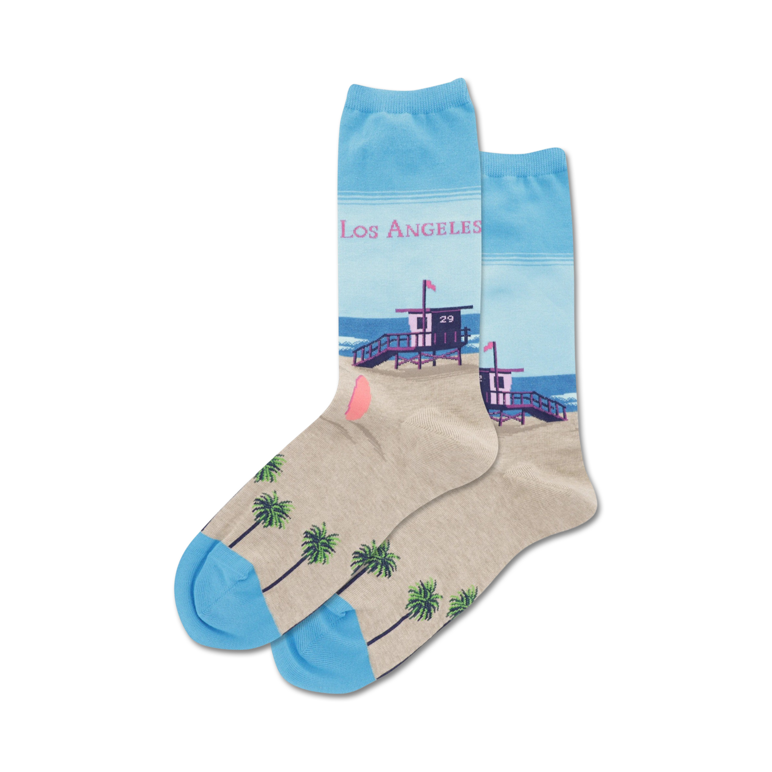 Pair of crew socks showcasing a Los Angeles beach scene. Light beige with palm trees at the bottom, light blue at the top with a lifeguard tower and 'Los Angeles' text.