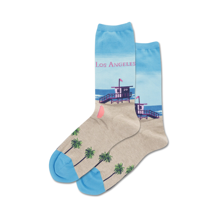 red lifeguard tower with 29 on sandy beach, palm trees, blue water, light blue sky with clouds. womens crew socks, los angeles.   }}