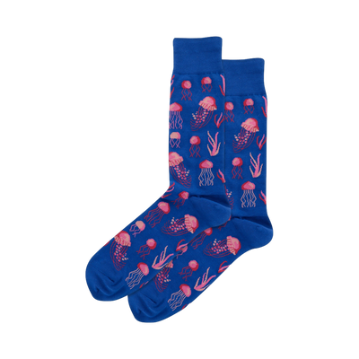 Pair of blue crew socks featuring a pixelated pink jellyfish and seaweed pattern.