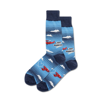 blue crew socks with red airplanes and white clouds pattern, "just married" text, perfect for newlyweds.   