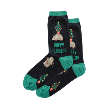 Crew socks in navy blue with teal cuffs.  Design includes armadillos carrying miniature Christmas trees and string lights.  'Happy Holidillos' is printed on the socks.
