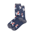 Pair of navy blue crew socks with a festive design.  Santa Claus rides a unicorn, repeated across the sock in a whimsical pattern. Subtle sparkly detail on the cuff.
