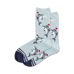 blue crew socks feature cartoon sharks wearing red santa hats, perfect for the holiday season.  