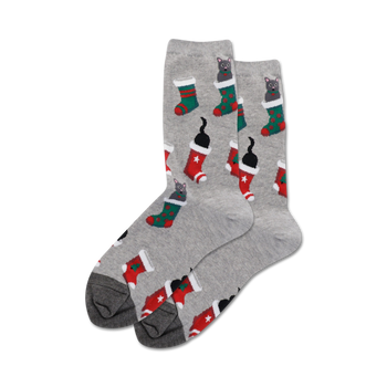 women's crew socks in gray with a pattern of black cats wearing red and green stockings with white cuffs and white stars.  