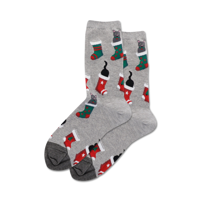 women's crew socks in gray with a pattern of black cats wearing red and green stockings with white cuffs and white stars.   }}