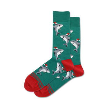 green crew socks with cartoon sharks in santa hats, red toes, green cuffs with two red stripes, suitable for men.  