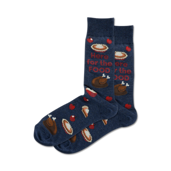 thanksgiving-themed blue crew socks with a pattern of pies, drumsticks, and hearts and the words 'here for the food'.  