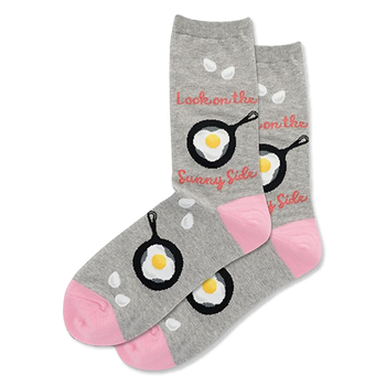 Pair of grey crew socks with black frying pans and fried eggs. Pink toes, white drop shapes, and "Sunny Side" text.