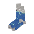 A pair of blue crew socks with a grey cuff. The socks feature a repeating pattern of light teal Loch Ness monsters swimming in the water, with a small house on a hill in the background.