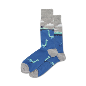 crew length men's socks with a plesiosaur pattern in a blue lake with a gray house and clouds.   