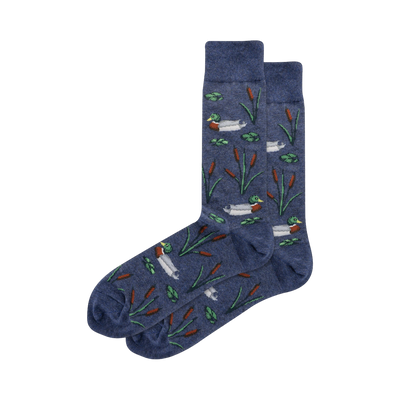 Pair of men's crew socks in navy blue.  They feature a repeating pattern of mallard ducks, cattails, and lily pads.
