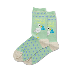 pregnancy themed mint green crew socks feature blue hearts and a yellow stork carrying a blue bundle with the words 'totally storked'.   