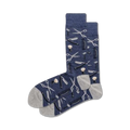 Pair of navy blue crew socks with a pattern of barber tools (scissors, razors, combs) in white and grey.