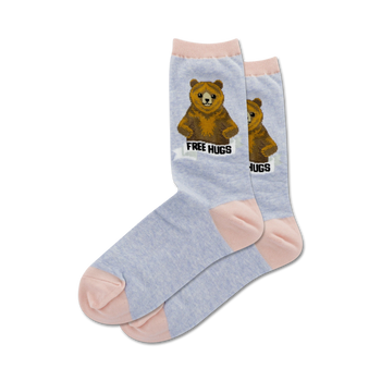 light blue socks with pink toe, heel, and cuff. brown bear with arms outstretched and 'free hugs' on chest. women's crew socks.   