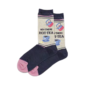 Cream-colored crew socks with navy blue feet and pink toes. Features a repeating pattern of teapots, teacups, and the phrase 'Hey There HOT-TEA'.