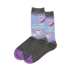 A pair of lavender 'Hey There HOT-TEA' socks with grey feet and purple toes. The design is similar to the main image but with a different color scheme.